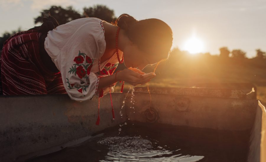 A woman smelling the water